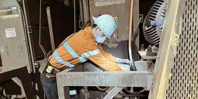 A-grade electrical contractor working safely underground in a mine on dewatering pump automation  