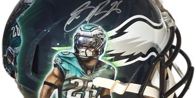 Philadelphia Eagles helmet with player graphic and autograph.