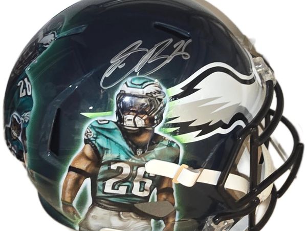 Philadelphia Eagles football helmet with player graphic and autograph.