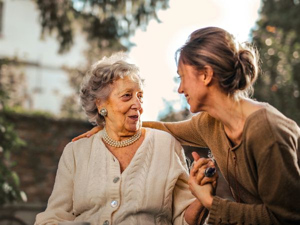 A carer speaking with an older woman