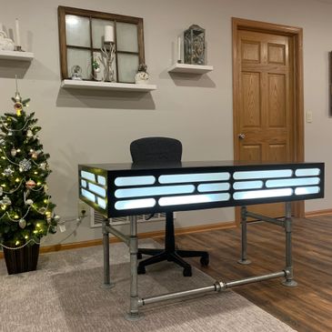 Custom Star Wars inspired desk. LED lighting and a metal pipe frame sized for the customer’s office.