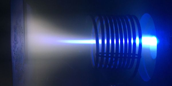 Vacuum arc plasma flowing through a short, straight solenoid before arriving at a substrate (left) 