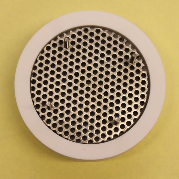 Multi-aperture ion extraction grid of a broad-beam ion source.