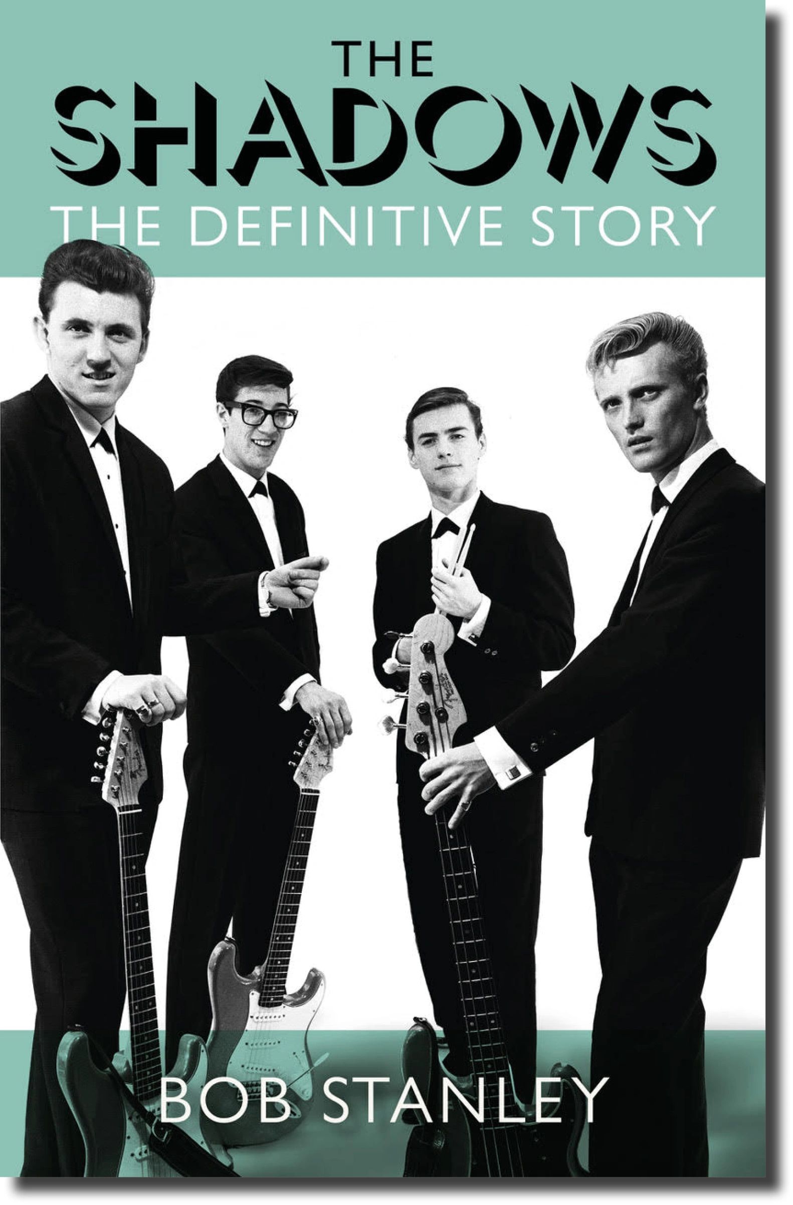 Black and white photo of The Shadows band members with guitars and stylish suits.