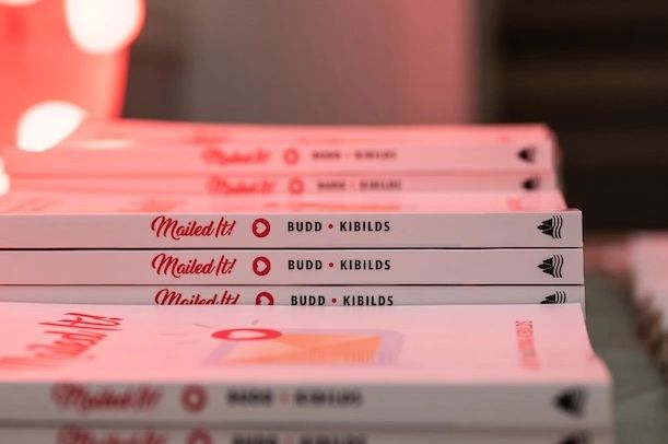 A stack of Mailed It! books