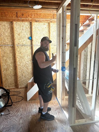 Licensed handyman framing wall during home remodeling and repair project