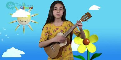 A girl playing a ukulele against a colorful cartoon background.