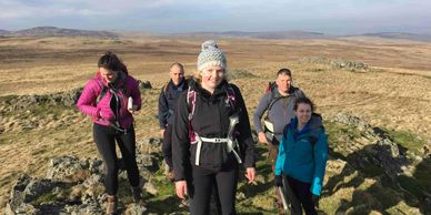 Group of walkers in the mountains on a guided walk in lake district