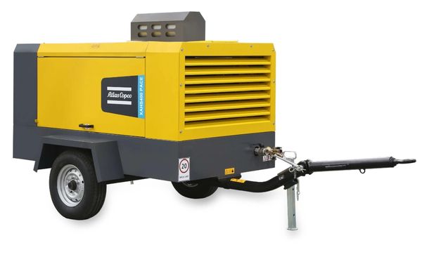Yellow and gray portable industrial air compressor trailer.