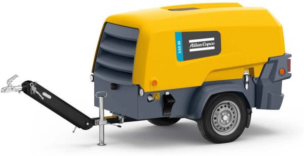 Yellow Atlas Copco portable air compressor on wheels.