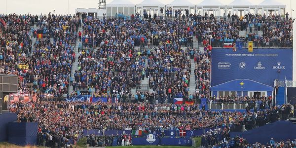 Golf crowd watching PGA Professional hit a golf shot in the Ryder Cup in Paris.