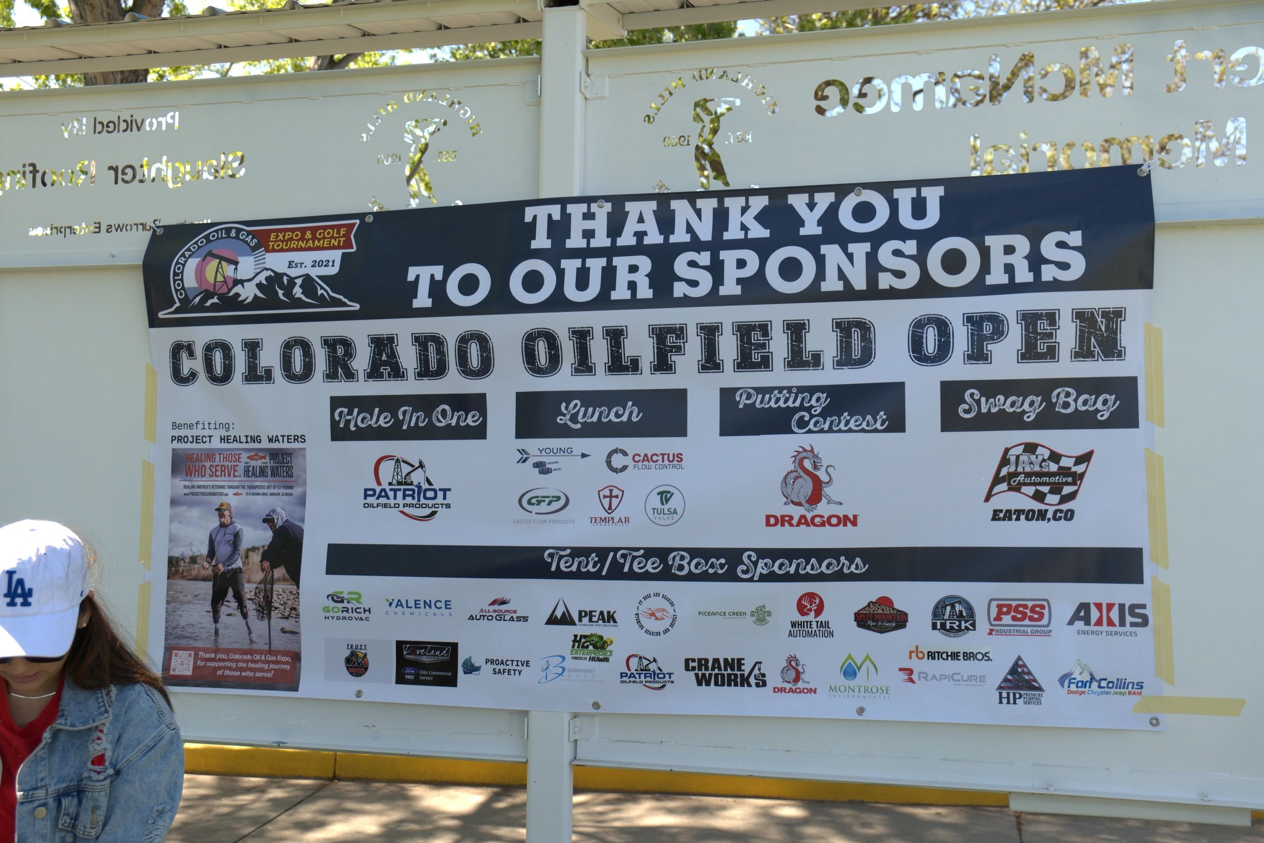 Banner thanking sponsors of the Colorado Oilfield Open golf tournament.