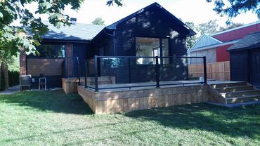 Pressure treated Deck complete with aluminum posts and glass railings 