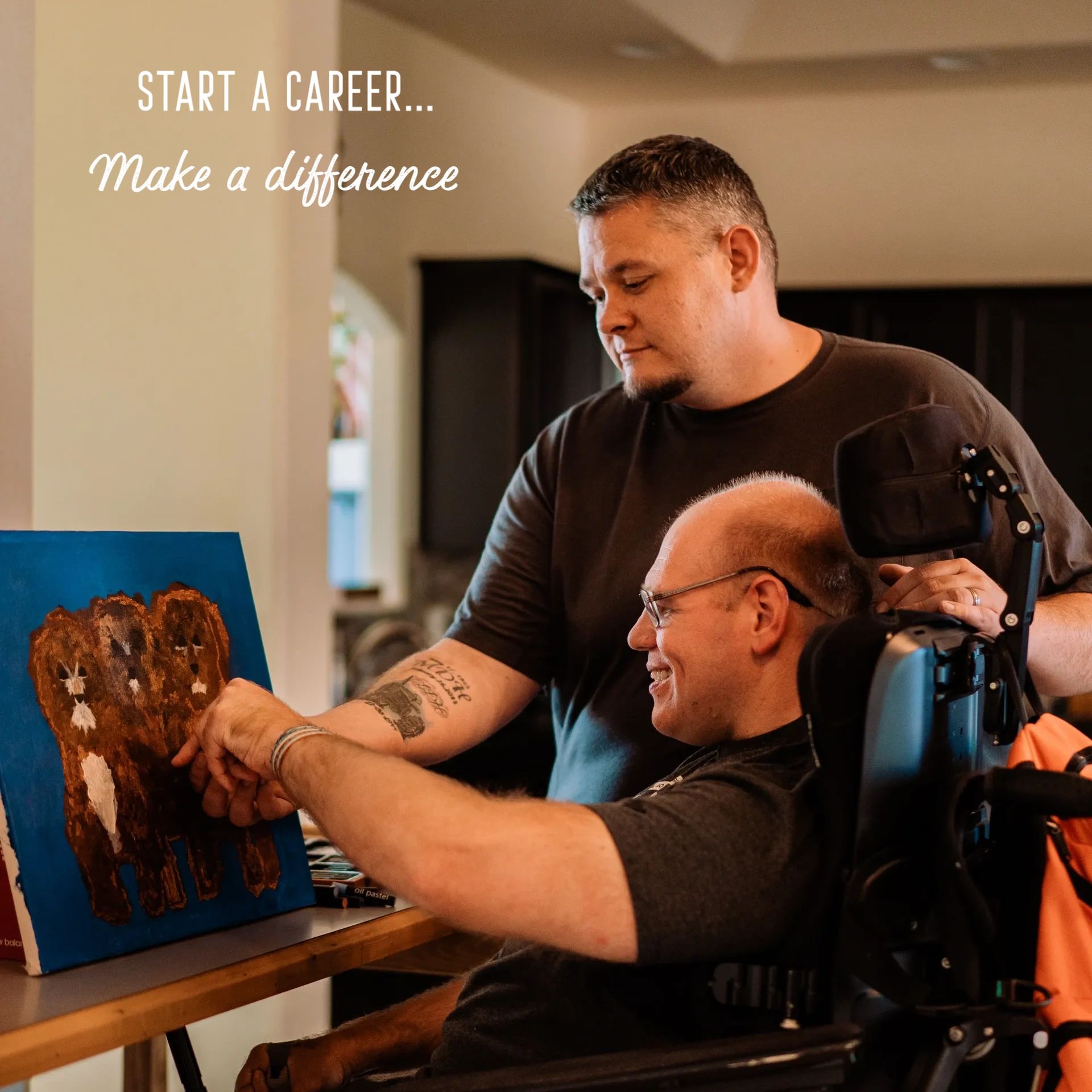 Support staff assisting a person receiving services with painting a picture of three brown dogs. Tex