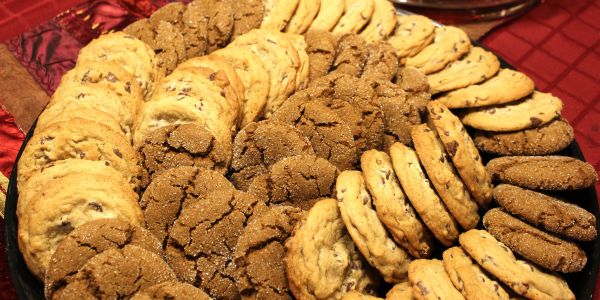 Plate of assorted cookies arranged in a spiral pattern.