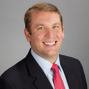 Professional man smiling in suit and tie
