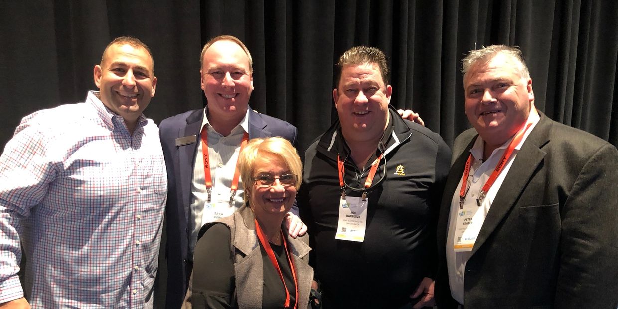 John Kaloukian with a group of colleagues - communication is key.