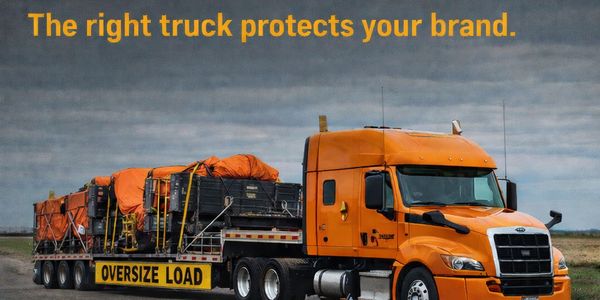 heavy haul truck transporting oversized over-dimensional equipment cargo; flatbed; step deck; RGN