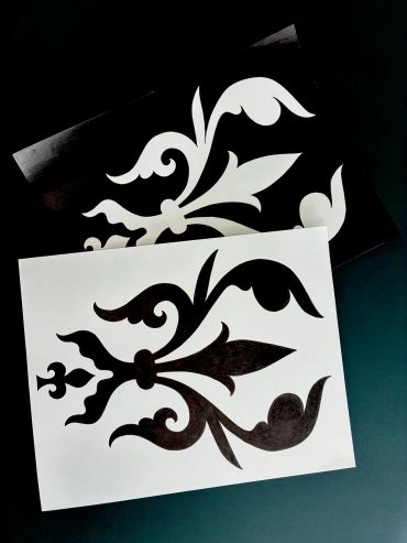 Black and white decorative floral patterns.