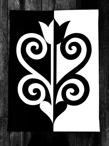 Black and white symmetrical abstract art with spirals.