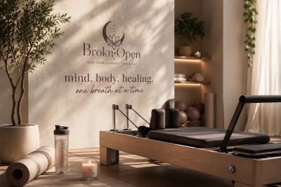 Calm Pilates studio with soothing lighting and wellness message.
