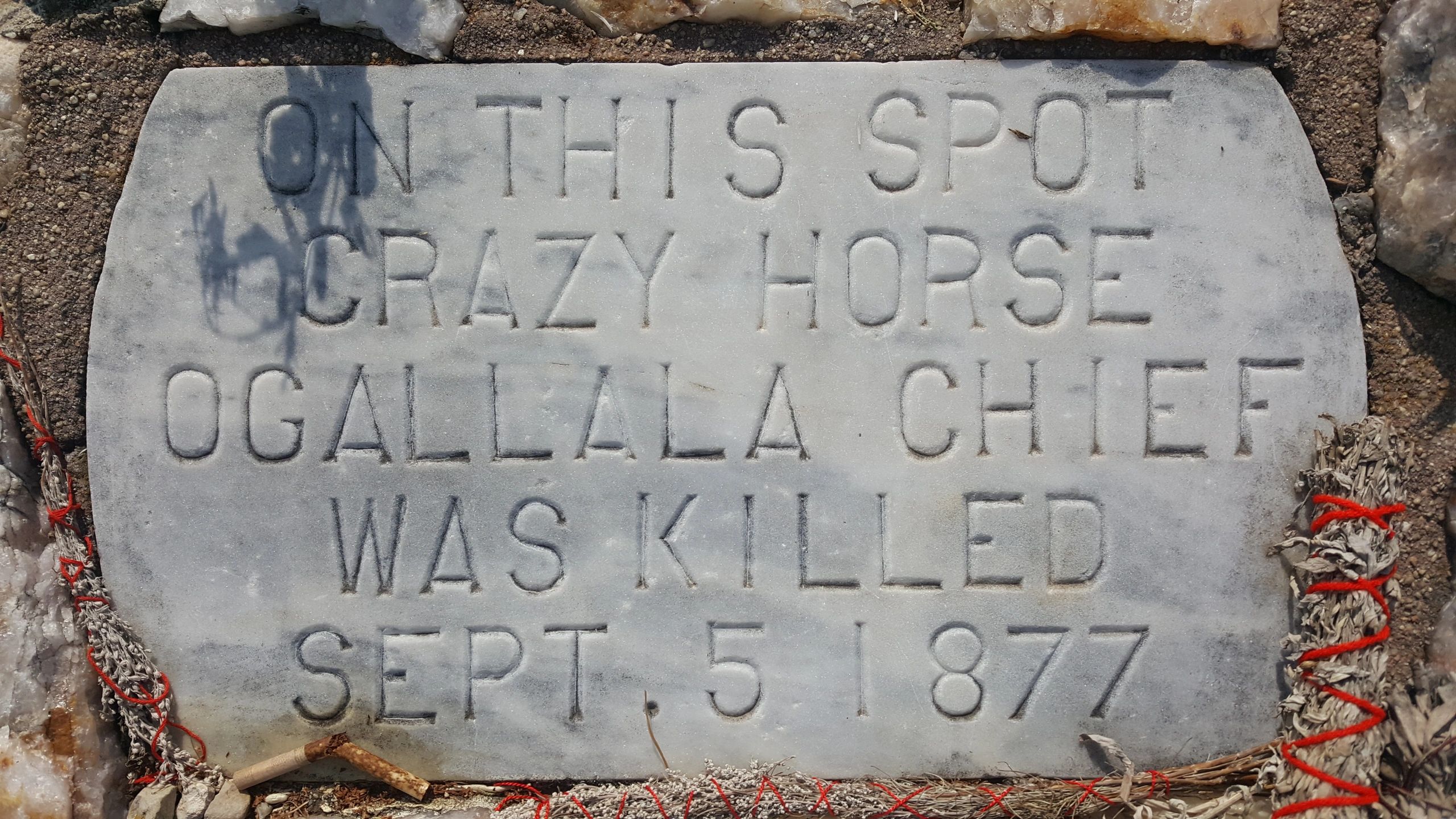 Stone plaque marking where Crazy Horse was killed on Sept 5, 1877.