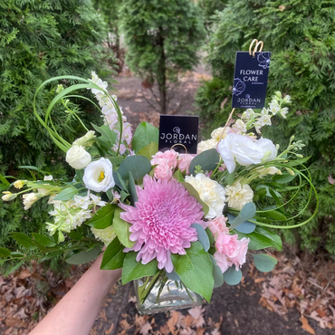 Fresh Arrangement to welcome a baby girl featuring a stunning mum, larkspur, spray roses, and lisian