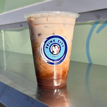 Iced chocolate drink in a clear cup with Drink City logo.