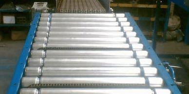roller conveyor attached to end of modular belt conveyor  system 