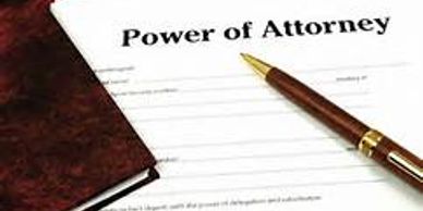 Power of Attorney document with a pen and notebook.