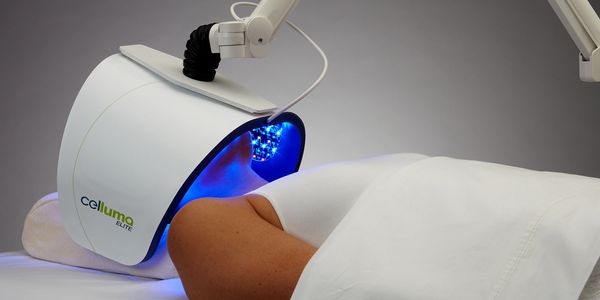 Person receiving light therapy with a Celluma device.