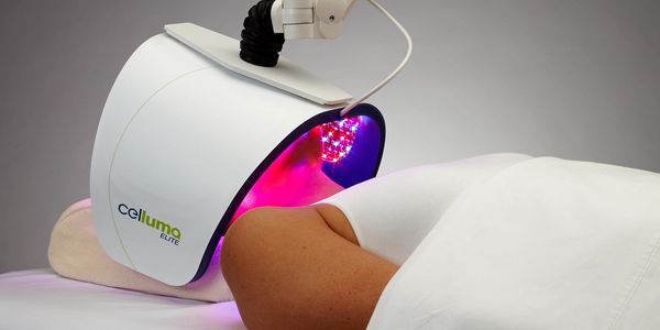 Person undergoing LED light therapy with Celluma Elite device.