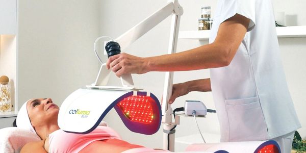 Woman receiving LED light therapy treatment.