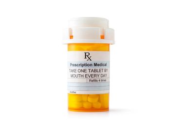 A Prescription bottle with medication in it