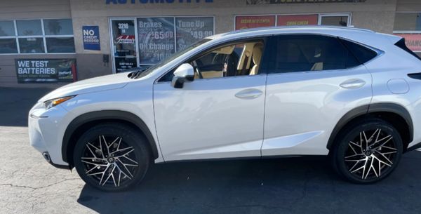 Well-maintained vehicle outside auto repair shop