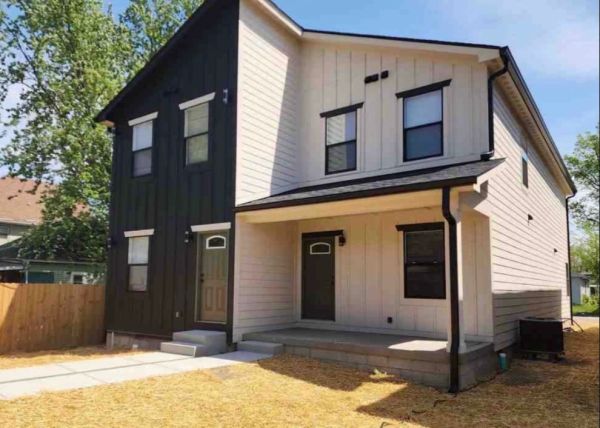Modern two-tone house with black and white siding.