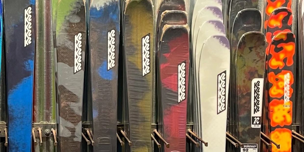 A colorful row of K2 brand skis on display.