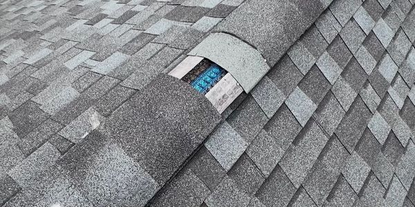 Missing ridge caps from storm damage.