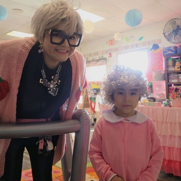 Two people dressed in vintage or costume attire.