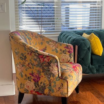 Armchair with floral velvet fabric.
