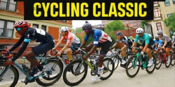 Cyclists racing in a classic cycling event on city streets.