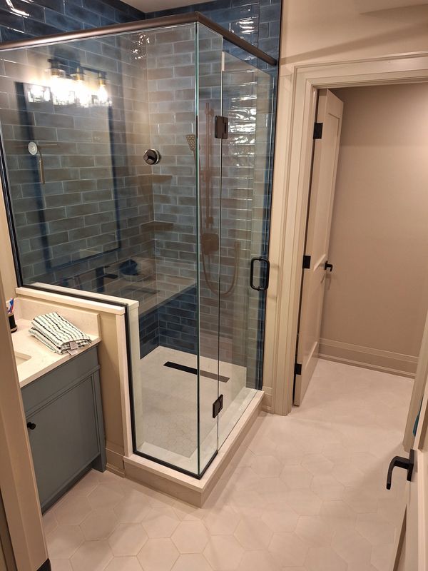 Tiled shower. Uniquely coloured tile. Blue Tiles