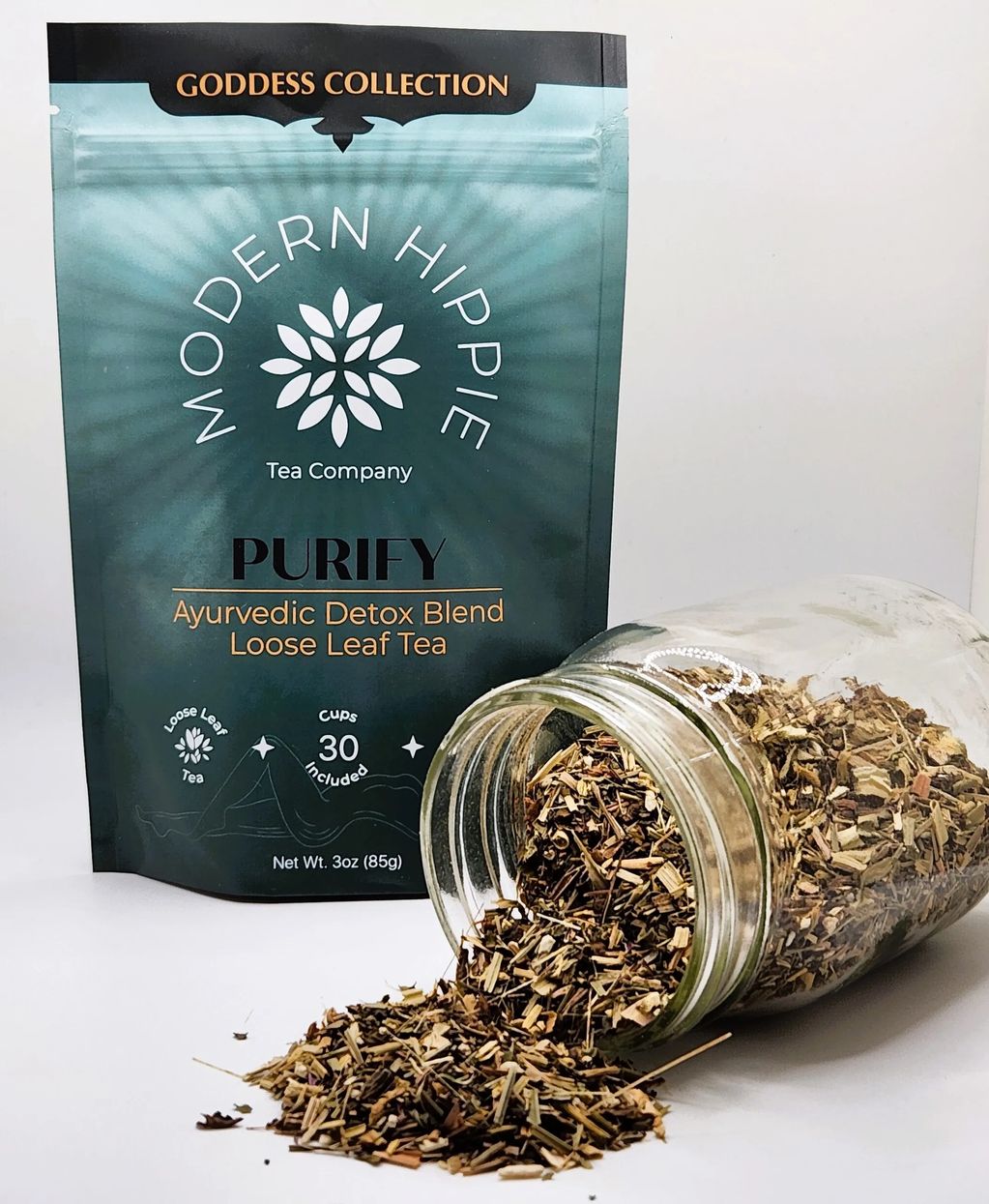 Purity tea blend - green colored package with loose leaf tea poured out