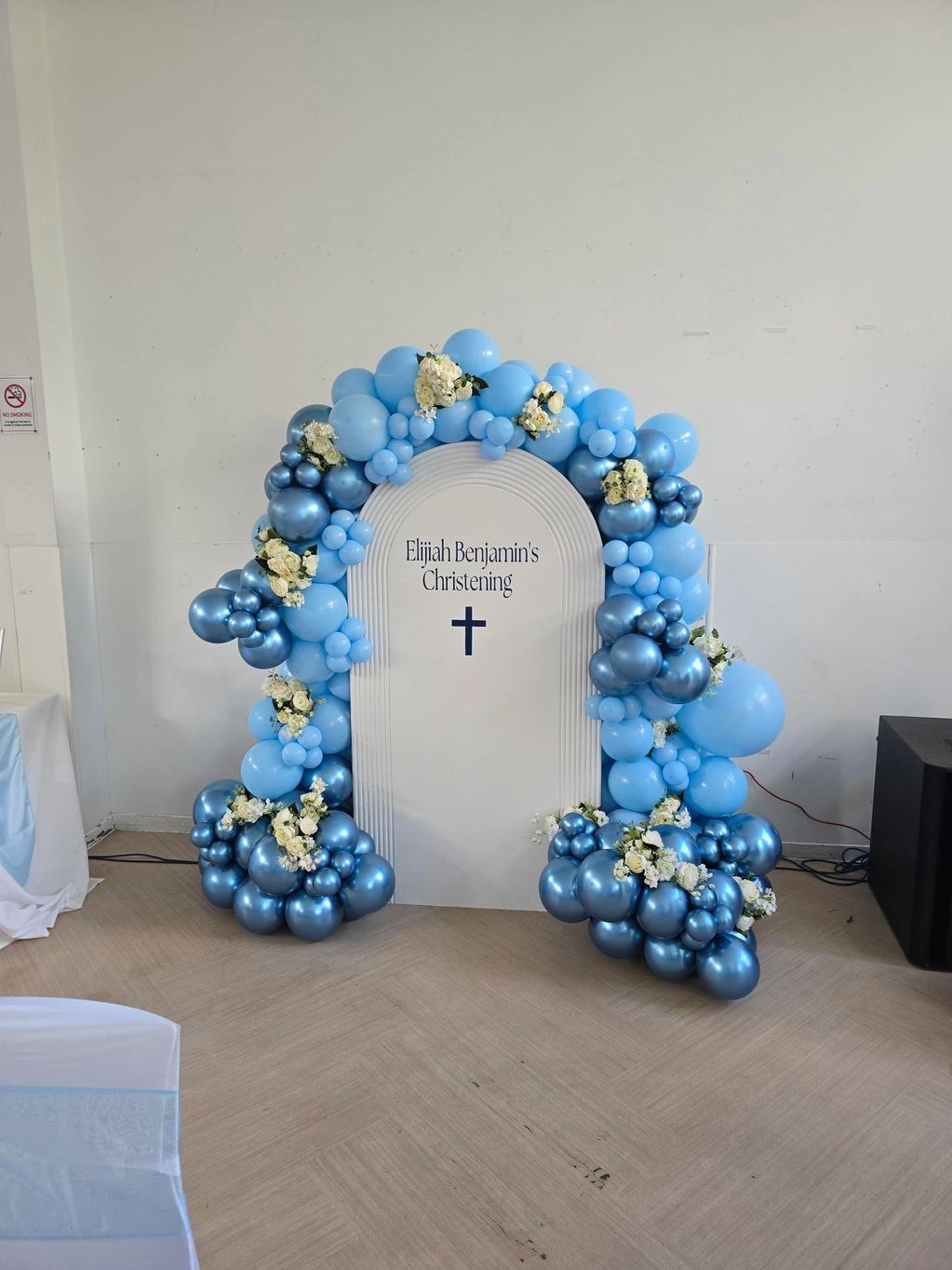Blue balloon arch backdrop for Elijah Benjamin's Christening.