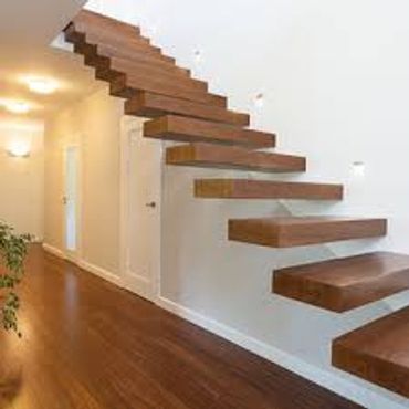 Floating wooden staircase in a modern home interior.