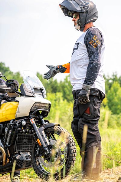 a man wearing helmet and rider costume 