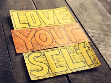 A colorful sign that reads: LOVE YOUR SELF.