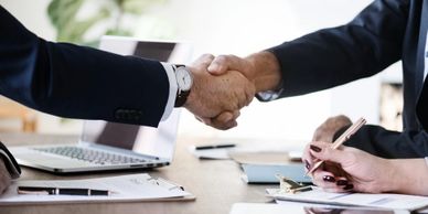 Contract agreement shaking hands