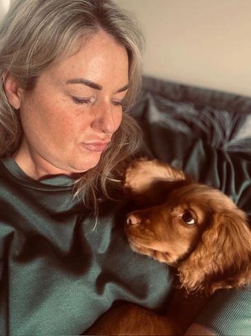 women and dog looking in love