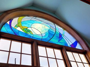 Stained glass half round window